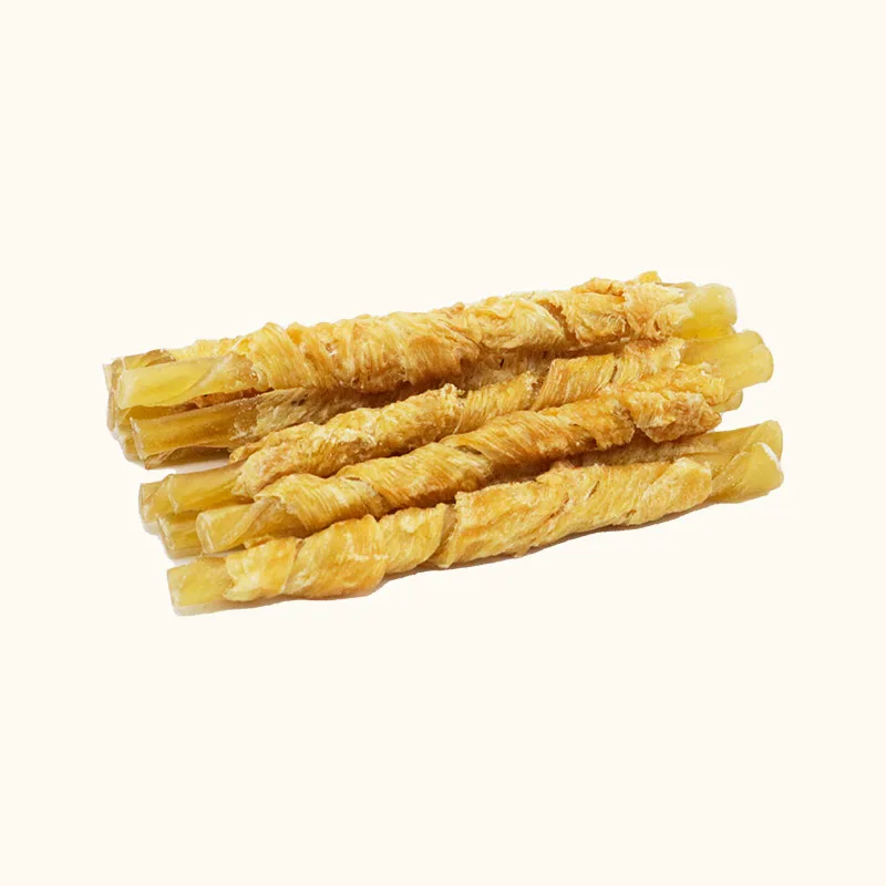 Pale rolled rawhide dog chew sticks with golden chicken wrapping