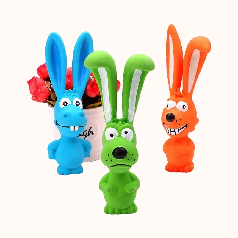 Blue, green and orange rabbit-shaped dog toys with long ears and different cartoon expressions