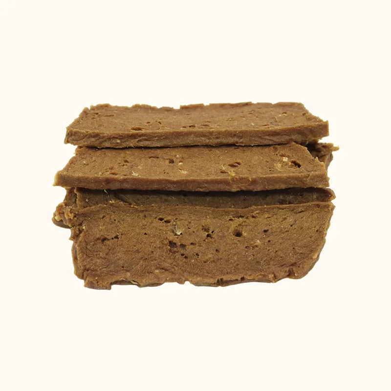 Stacked brown composite beef dog treat slices with broad flat surfaces