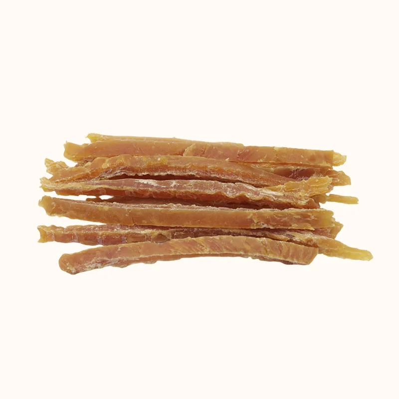 Thin golden-brown Chicken Strip dog treats stacked horizontally