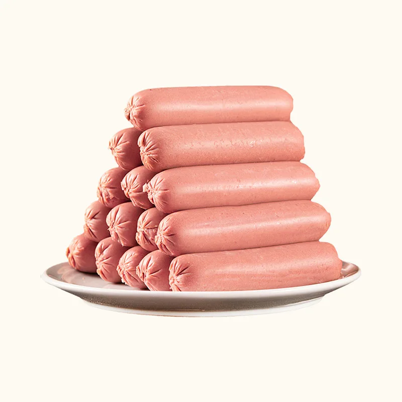 Pink individually wrapped pet ham sausages stacked on a white plate