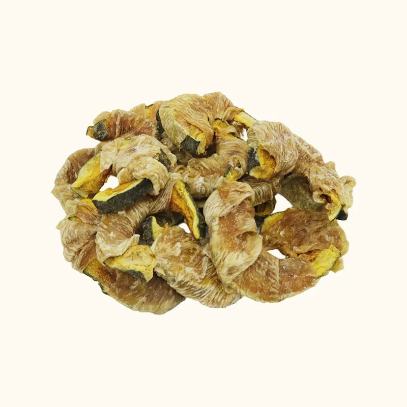 Curved pumpkin pieces with golden chicken wrapping in a pile