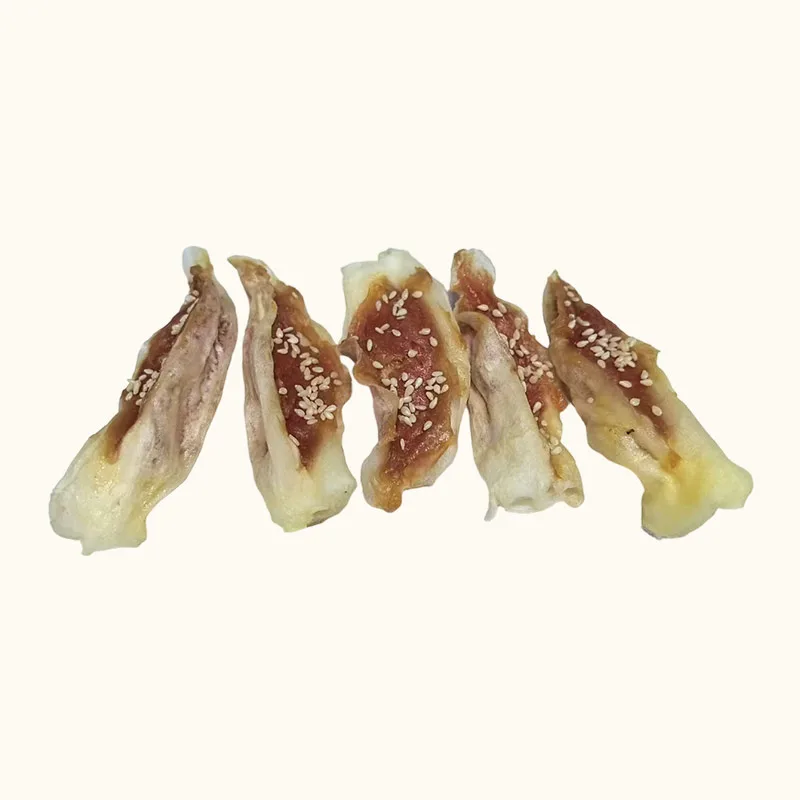 Rabbit ear dog treats with pale ends and brown chicken paste coating