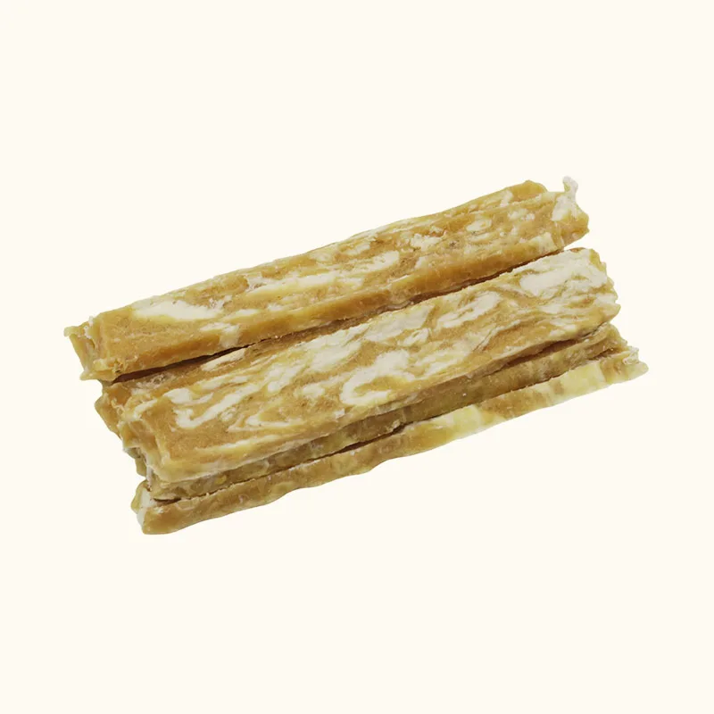 Golden Snowflake Chicken dog treat strips with pale marbled patterns