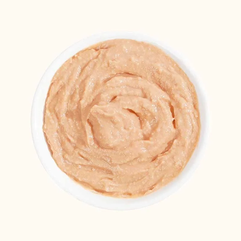 Pinkish Cat Strips meat puree with a swirled surface in a round white dish